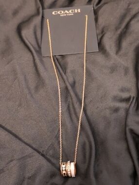 COACH  Gold Necklace with White, Black and Crystal Accent Rings